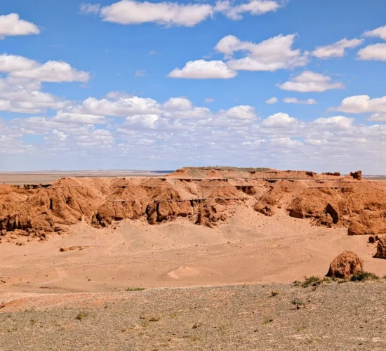 12-day Mongolia tour stop at the Flaming Cliffs of Bayanzag in the Gobi Desert